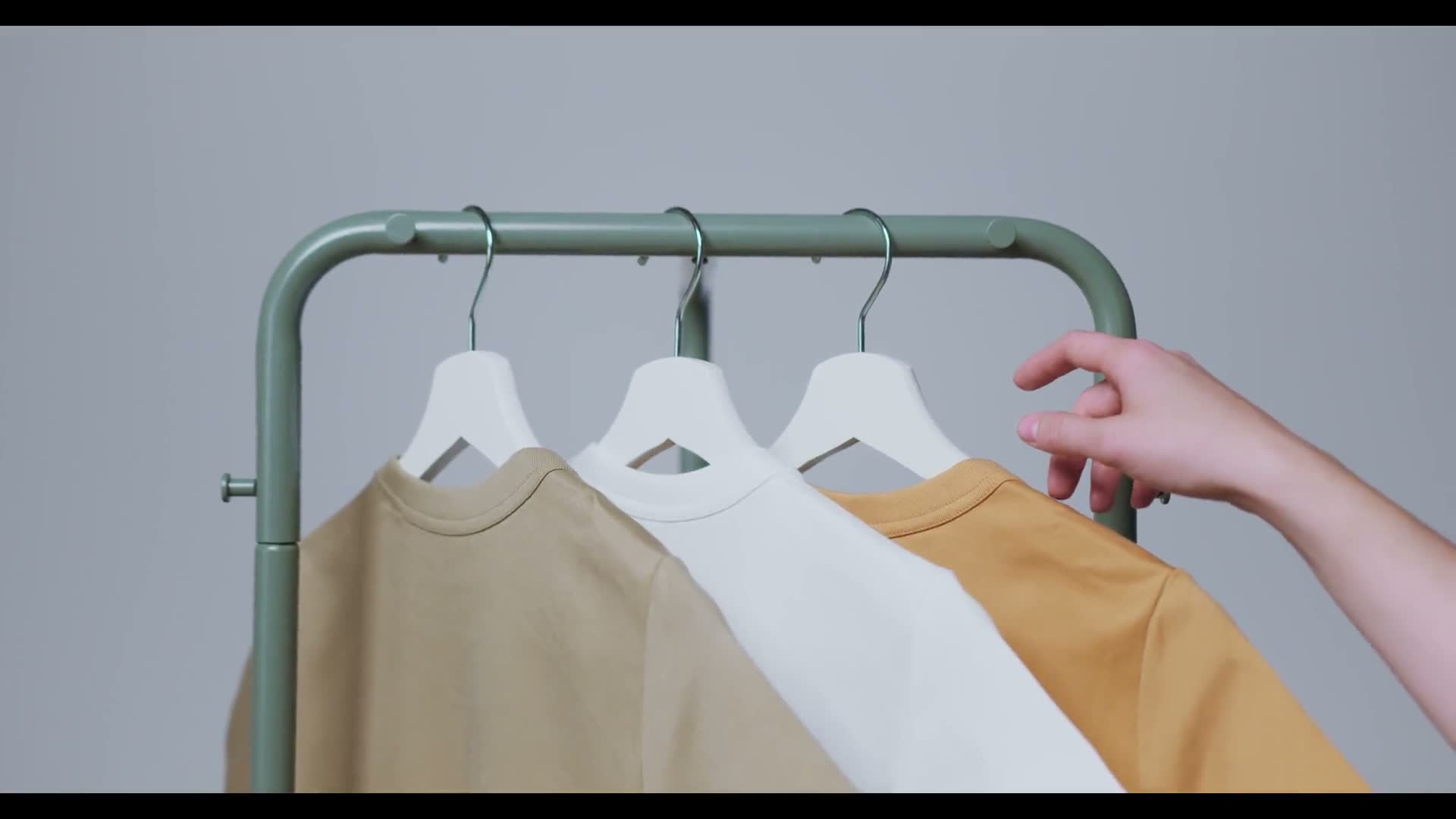 Supima cotton t-shirts hanging on a clothing rack at Garmium